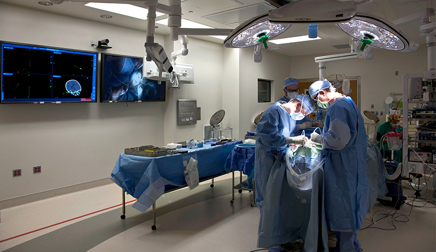 Doctors performing sugery in the neurosurgical ICU